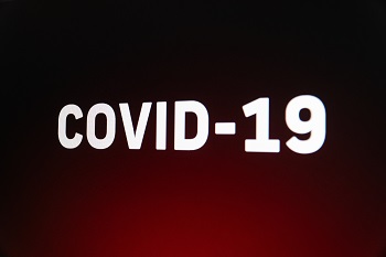 COVID-19 white lettering on red background